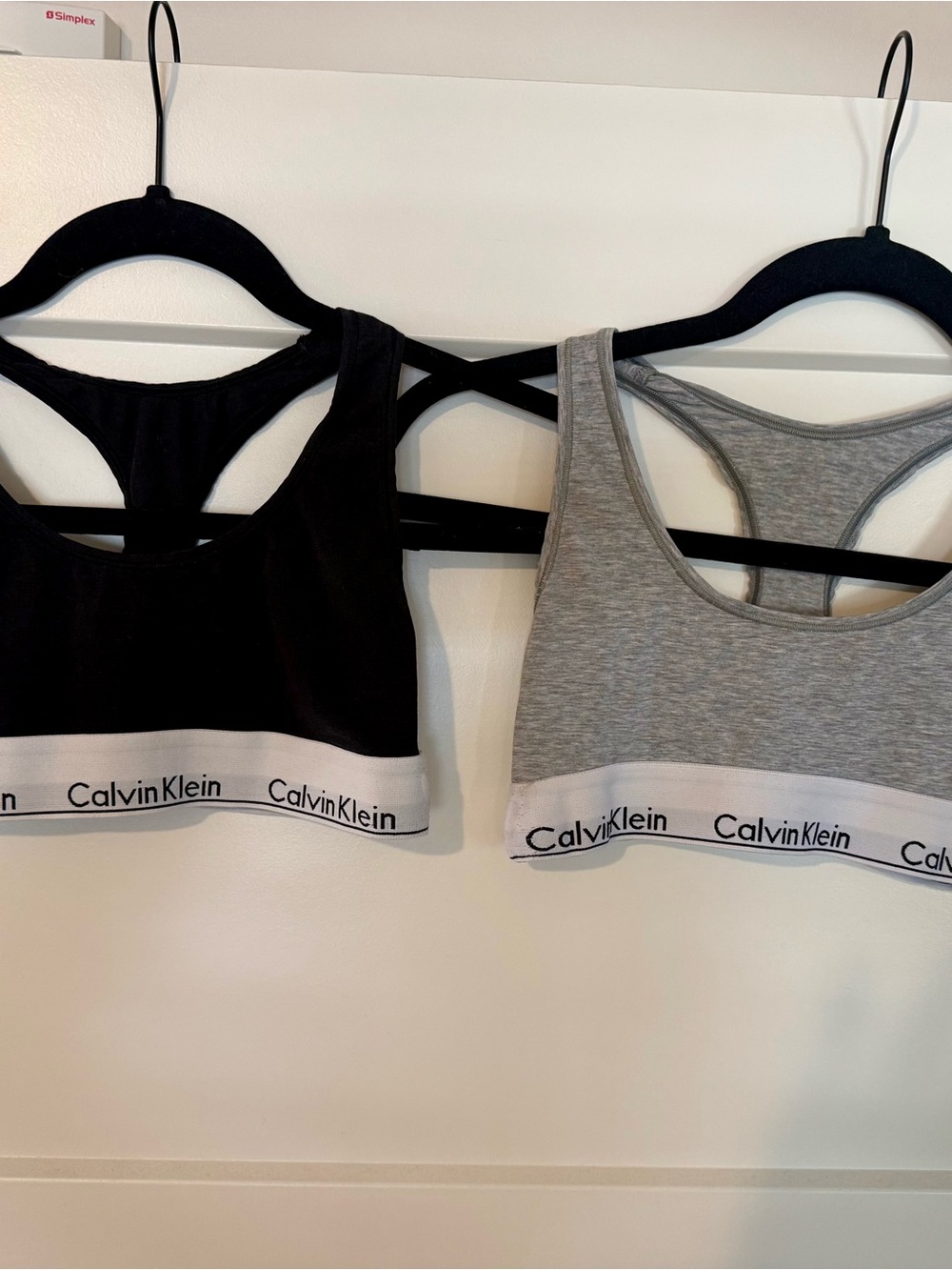 TWO Calvin Klein Racerback Bralettes - Gray & Black in size Small